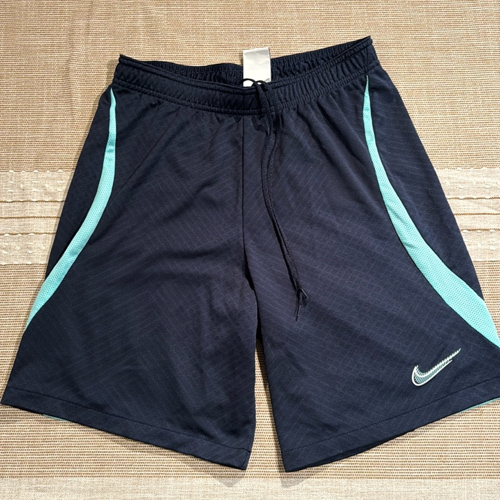 Nike gym shorts.  Size small slim fit.  Navy with Turquoise accents.